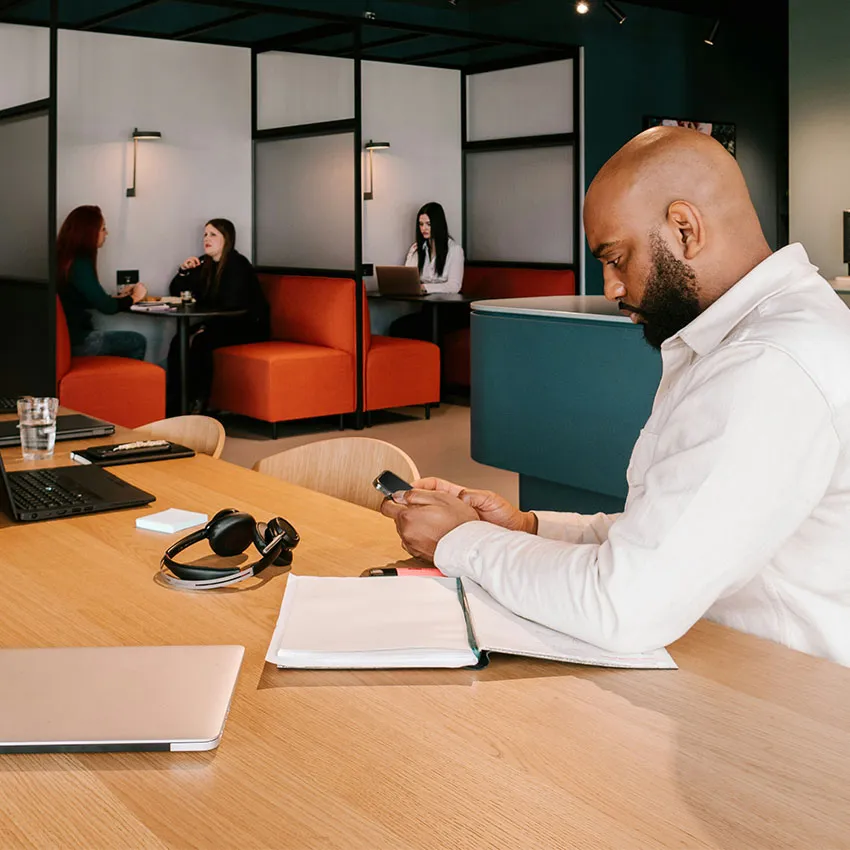 Person working on laptop in modern office